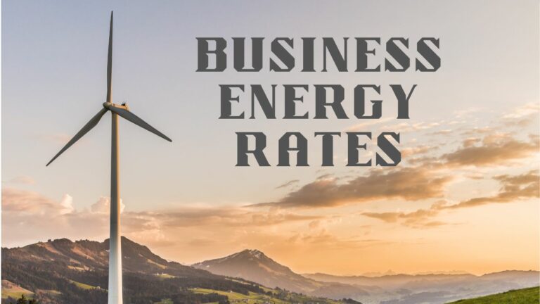 Scenic photograph of a single wind turbine silhouetted against a sunrise or sunset sky with orange and pink clouds, standing on rolling hills with mountain ranges visible in the misty background. Bold stencil-style text reading 'BUSINESS ENERGY RATES' overlays the upper portion of the image.