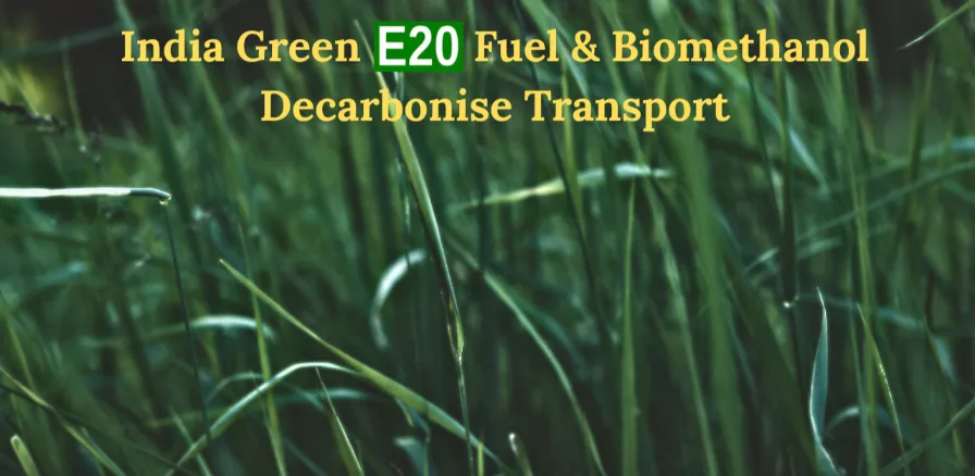 Lush green grass background with text overlay "India Green E20 Fuel & Biomethanol Decarbonise Transport" where E20 is highlighted in a green box.