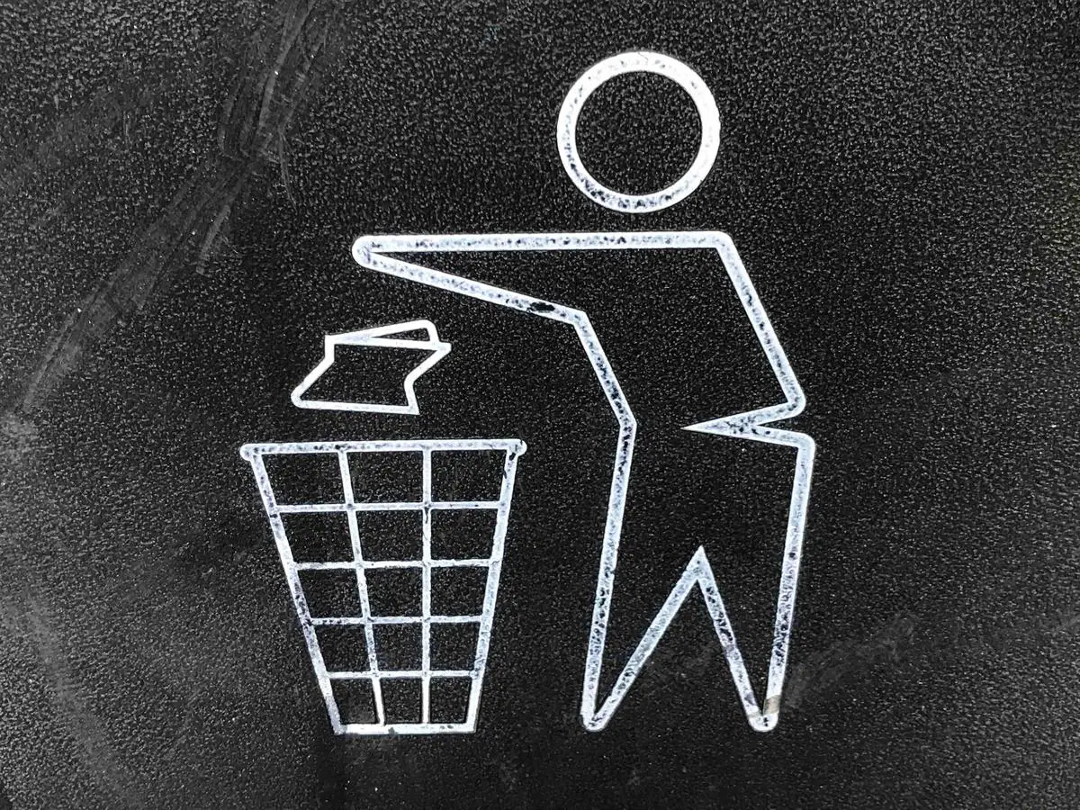 An image depicting different waste management practices with arrows representing the transition towards sustainable waste management